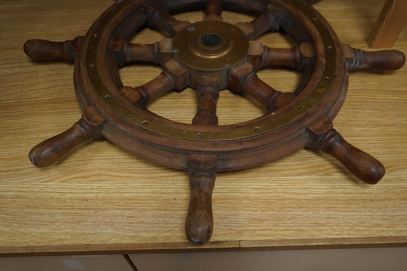 Maritime interest, a brass mounted hardwood ship’s wheel, 68cm in diameter. Condition - fair